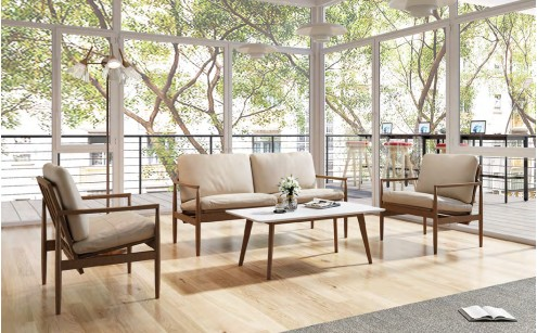 Professional business consultant reviewing office furniture catalogs for a procurement project.