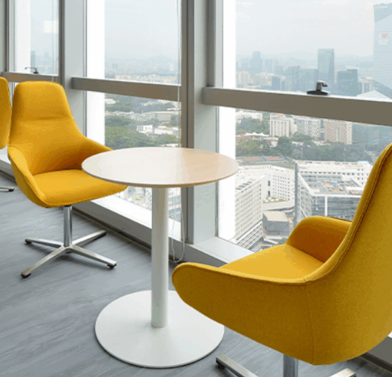 Ergonomic sit-stand desks and task chairs in a professional workspace