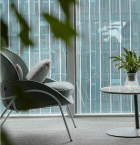 Modern 2026 open-plan office with modular workstations and ergonomic chairs