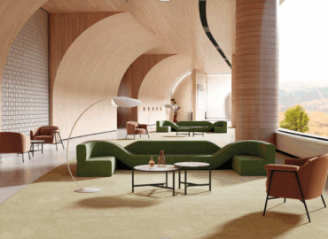 A group of modular office booths installed in a corporate lobby area