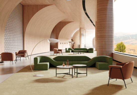 Modern open office featuring several commercial height adjustable desks in a collaborative setting