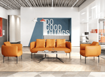Modern open office space with several height adjustable workstations in use
