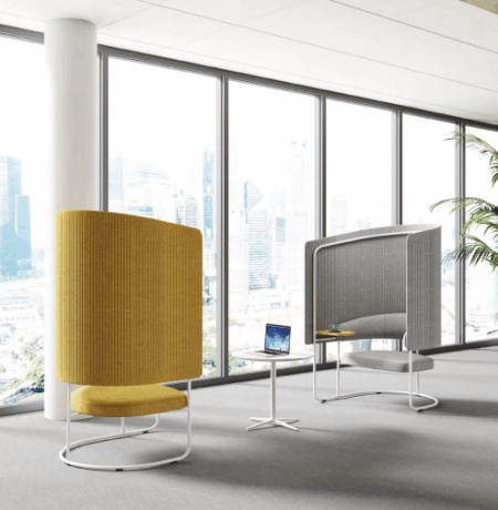 Modern corporate office featuring rows of bulk-sourced ergonomic workstations in a 2026 layout