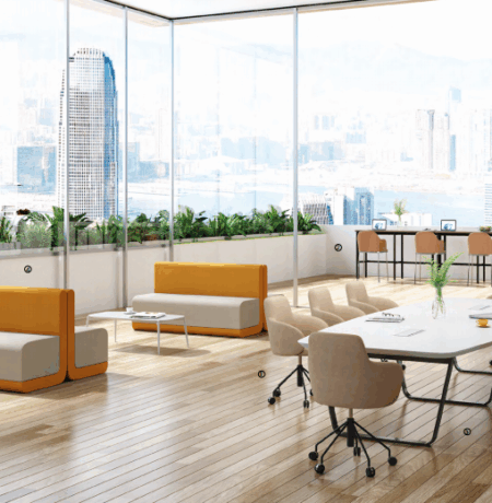 A professional furniture consultant reviewing floor plans with a university procurement team