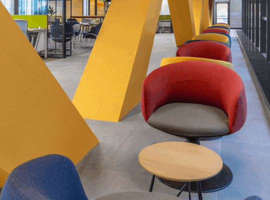 A team of project managers discussing space planning solutions with a modular cubicle supplier