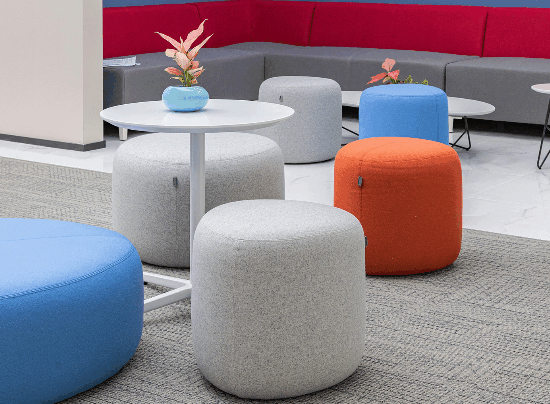 Ergonomic office furniture layout featuring a curved reception desk