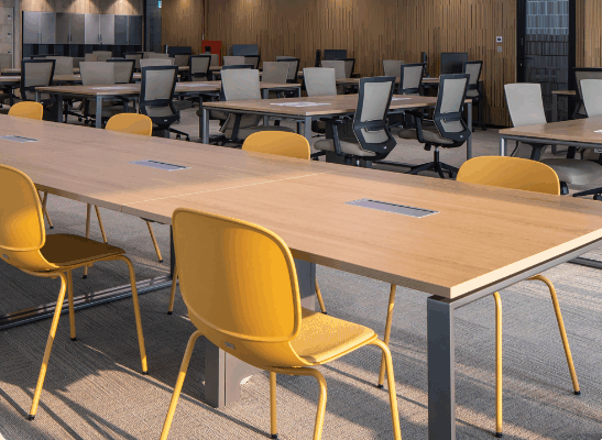 Professional office lounge area with designer sofas and soft lighting